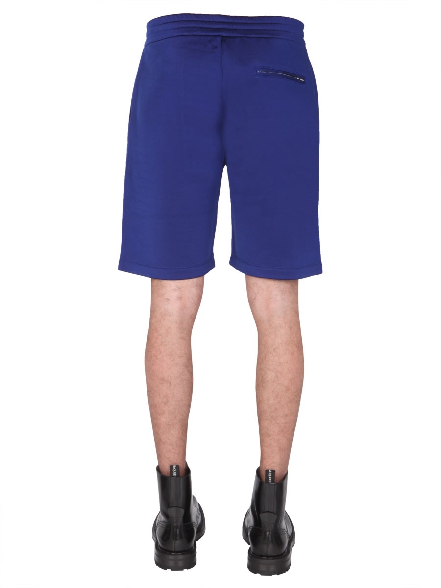 Shop Alexander Mcqueen Shorts With Embroidered Logo In Blue