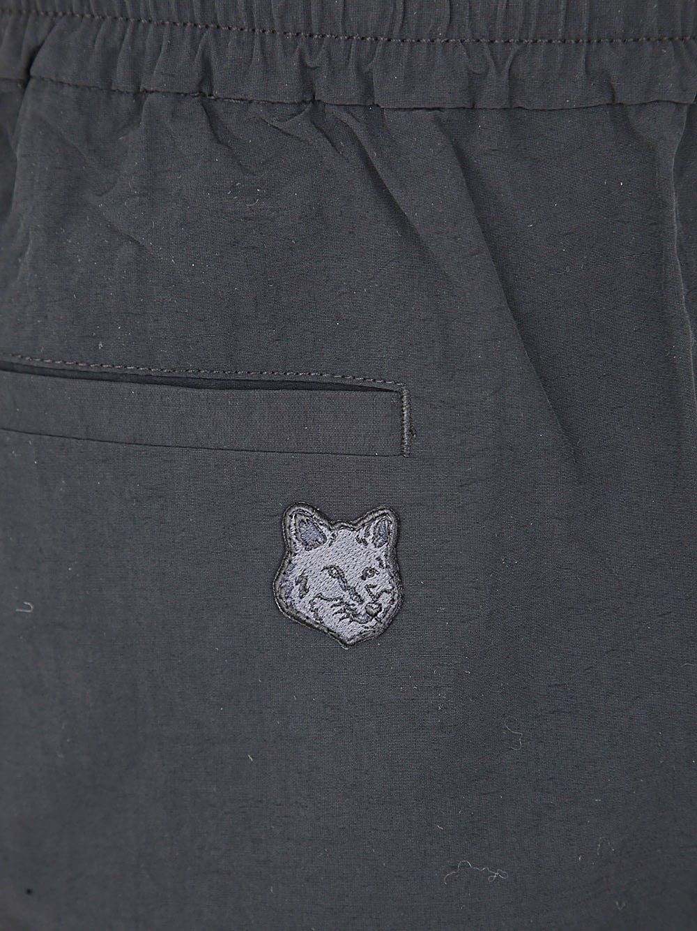 Shop Maison Kitsuné City Pants In Crispy Nylon With Tonal Fox Head Pat In Black