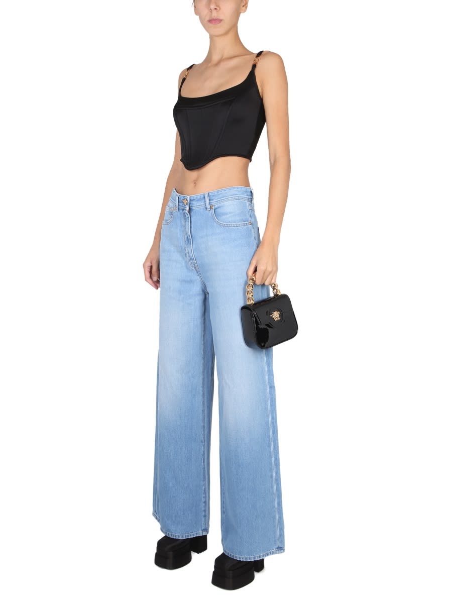 Shop Versace Medusa Wide Leg Jeans In Blue