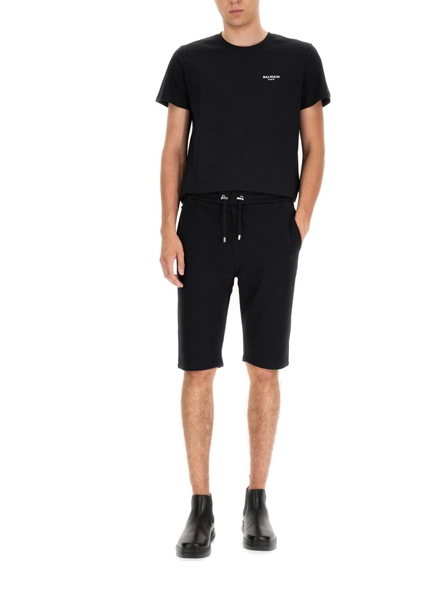 Shop Balmain Flocked Logo Shorts In Black
