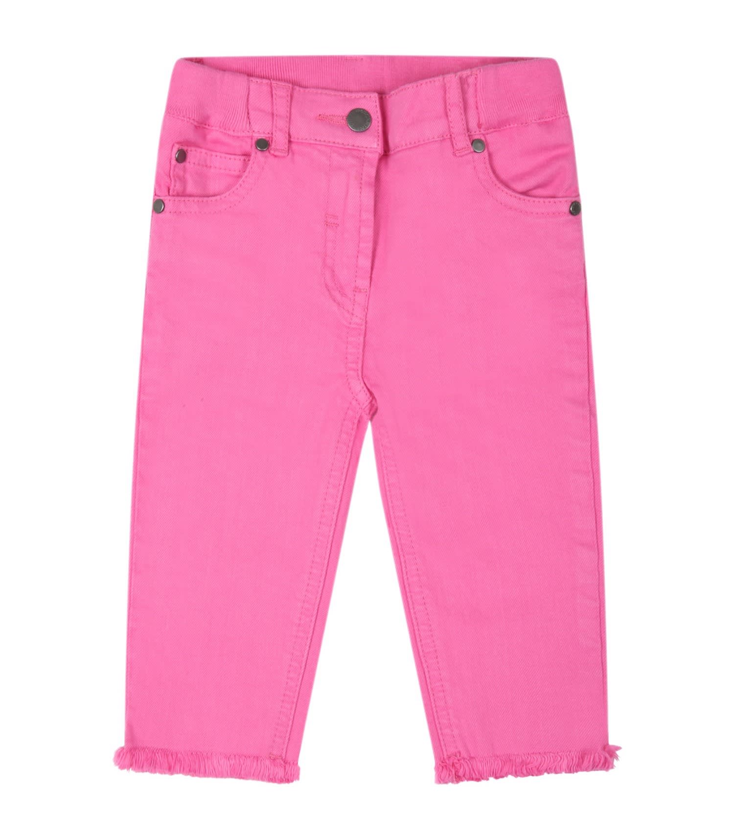 stella-mccartney-fuchsia-jeans-for-baby-girl-with-logo-patch-in-pink