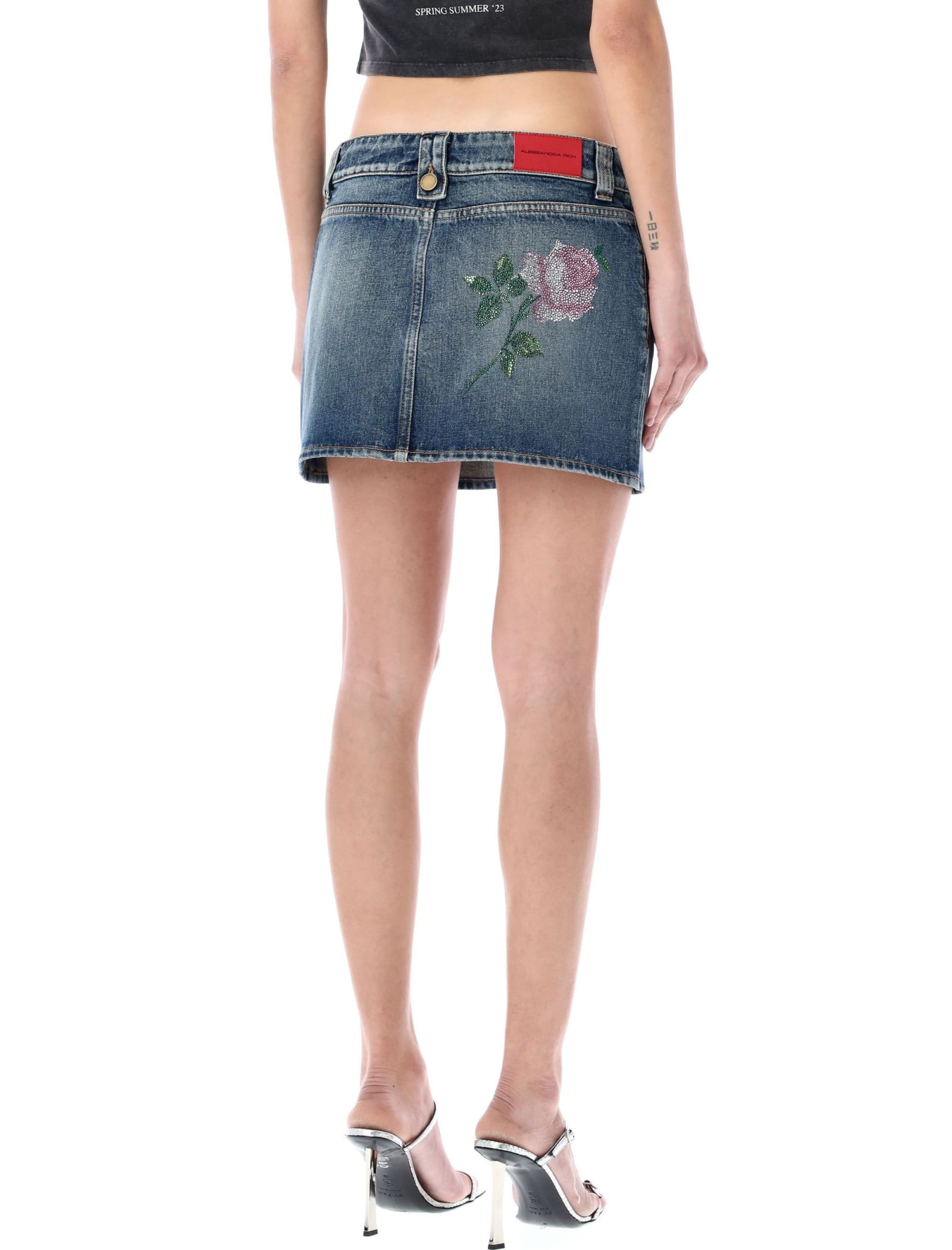 ALESSANDRA RICH DENIM MINI SKIRT WITH CRYSTAL ROSE