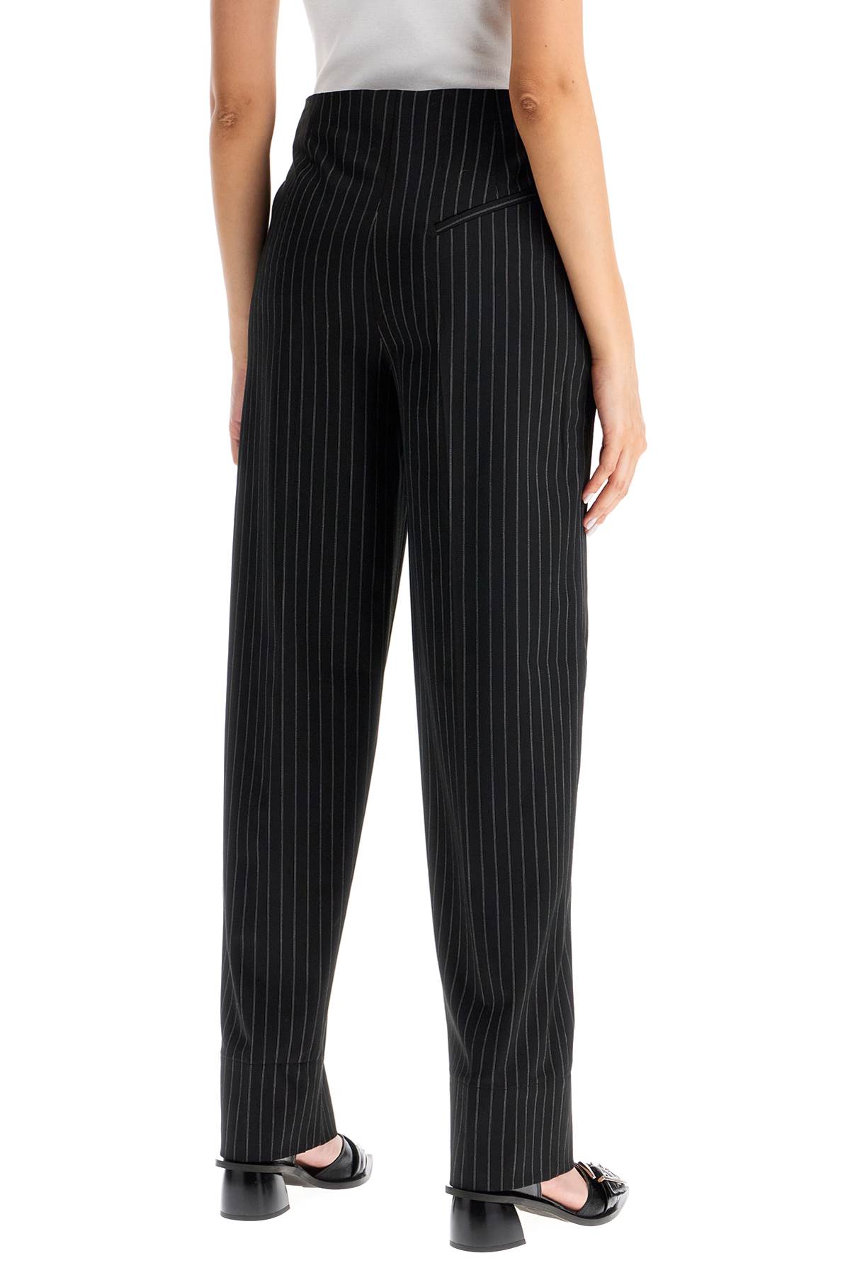 Shop Ganni Striped Tapered Trousers In Black (black)