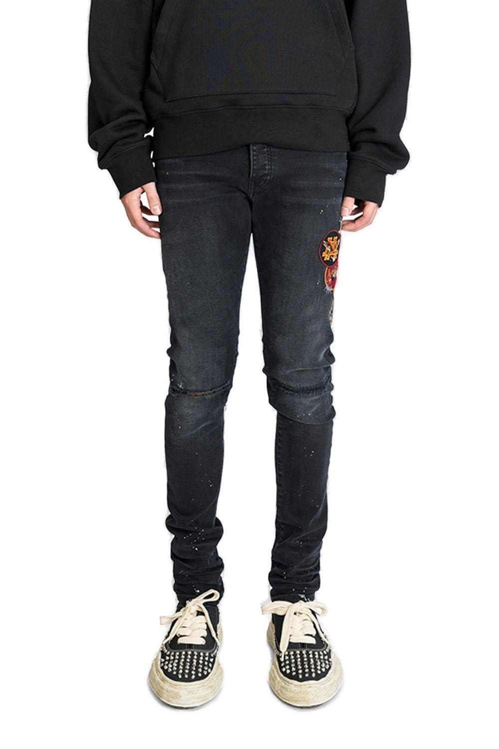 Logo Patch Distressed Skinny Jeans