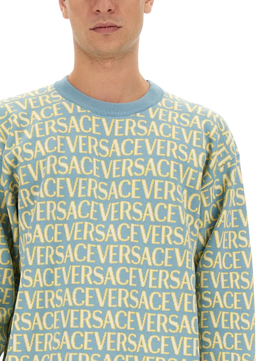 Shop Versace Allover Logo Jersey In Multicolour