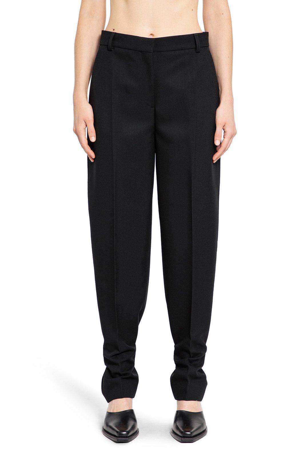 Shop Totême Pressed Crease Tapered-leg Trousers In 001 Black