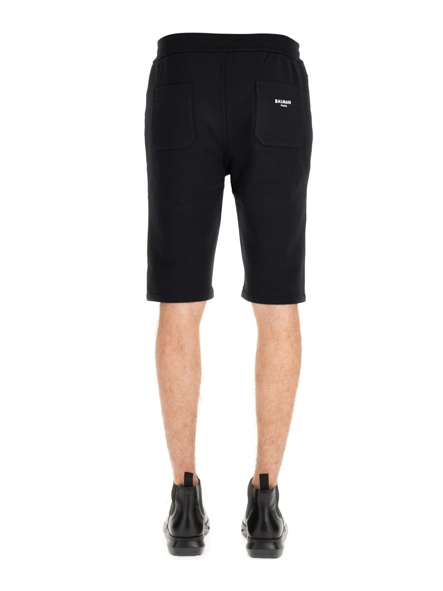 Shop Balmain Flocked Logo Shorts In Black