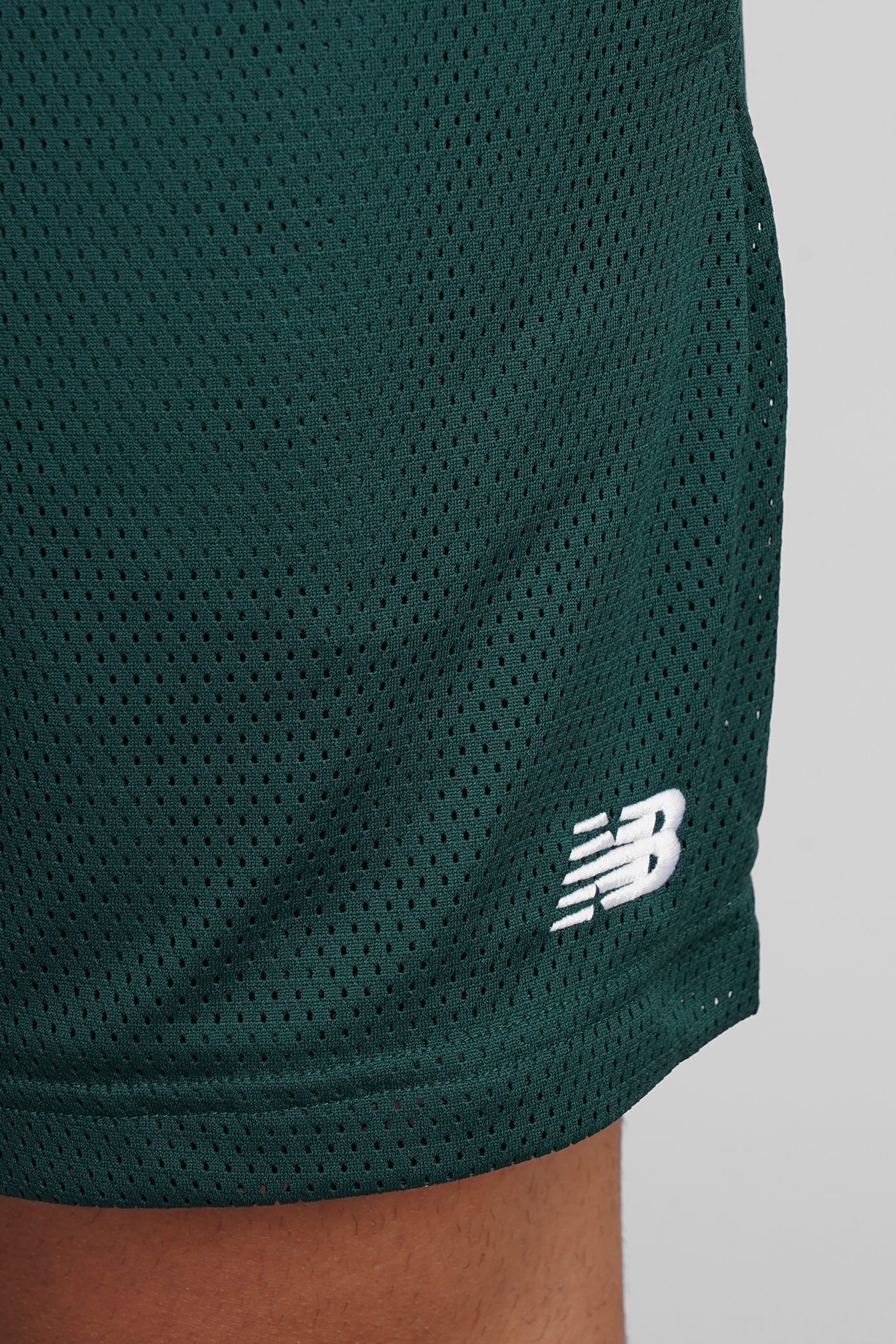 NEW BALANCE SHORTS IN GREEN POLYESTER
