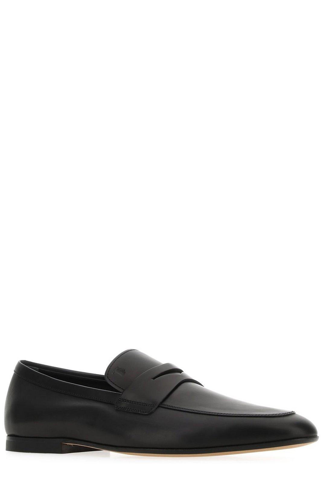 Shop Tod's Logo-embossed Slip-on Loafers Tods In Black