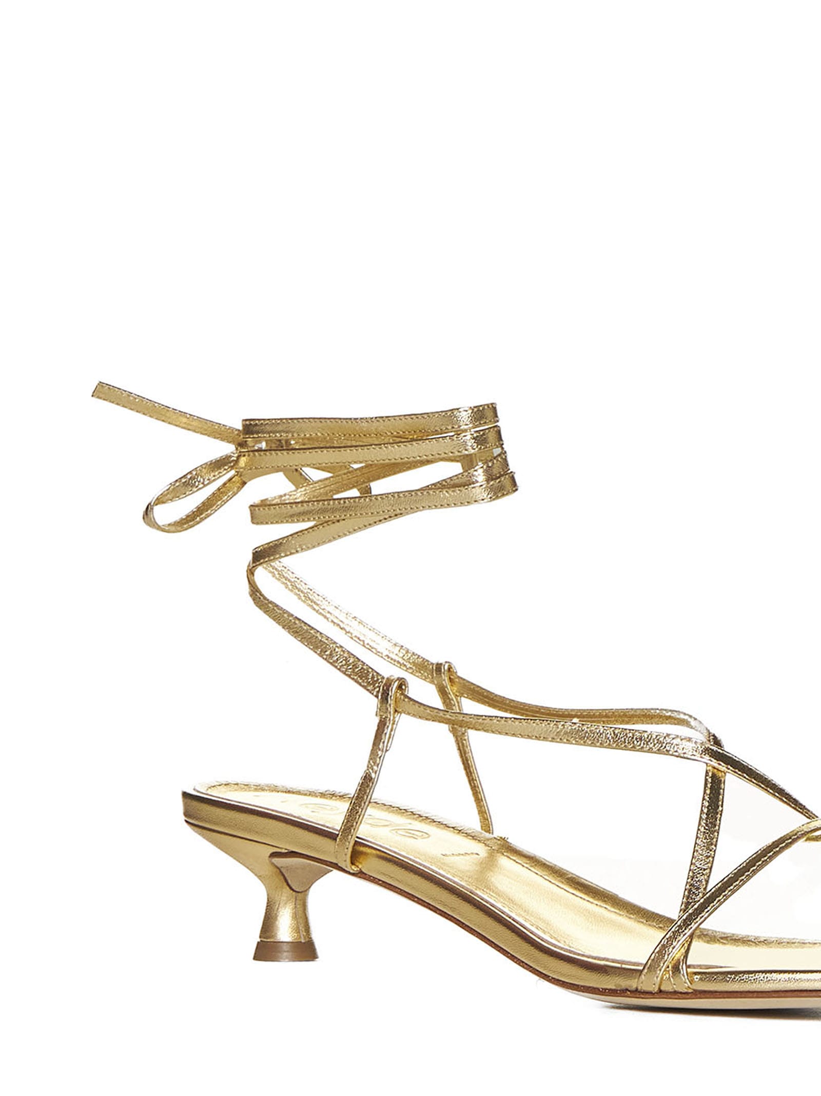 Shop Aeyde Sandals In Gold