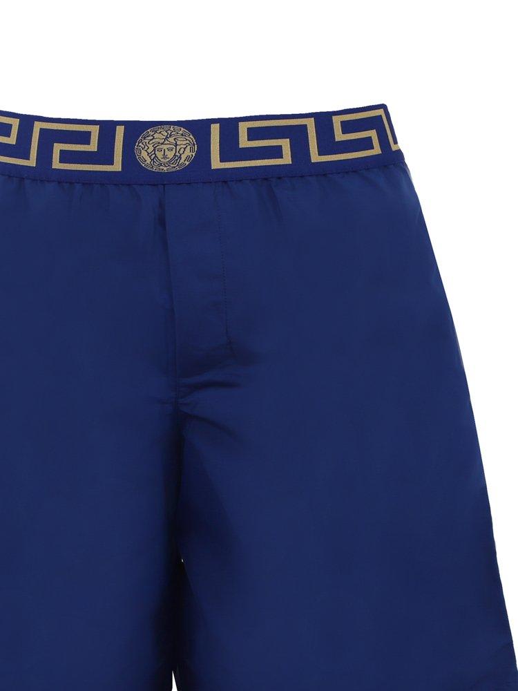 Shop Versace Greca Waistband Swim Shorts In Blu