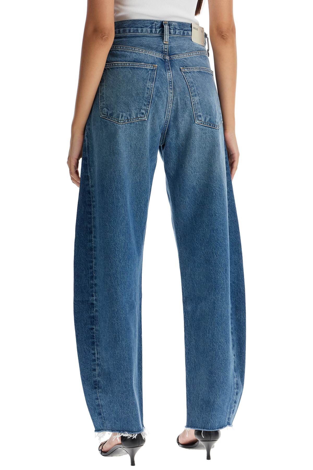 Shop Agolde Luna Curved Leg Jeans In Split (blue)