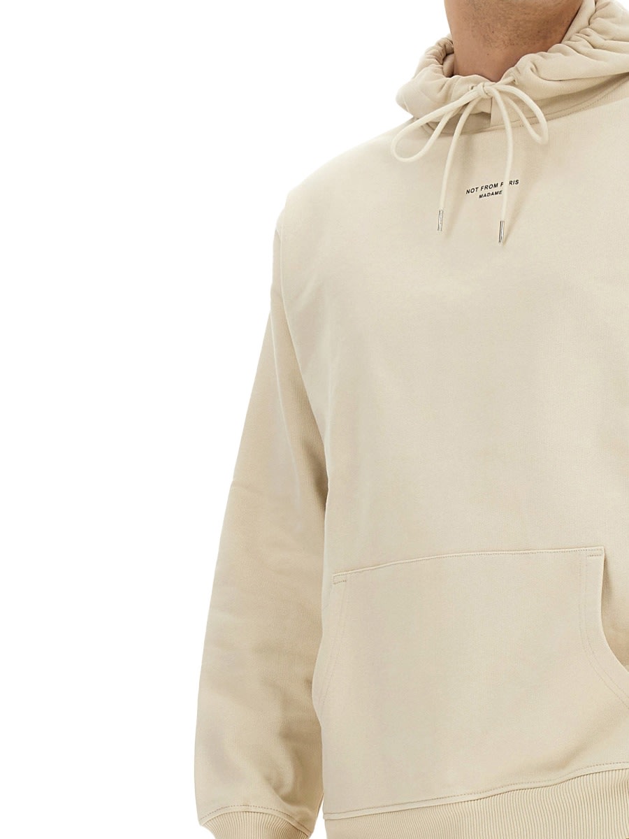 Shop Drôle De Monsieur Hoodie In Beige