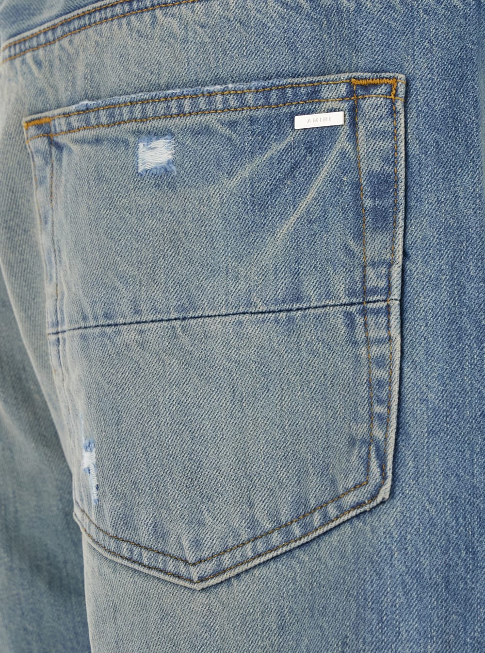 Amiri Men Blue Jeans With Ripped Details On The Front And Logo Patch On The Rear In Denim Man In Blue