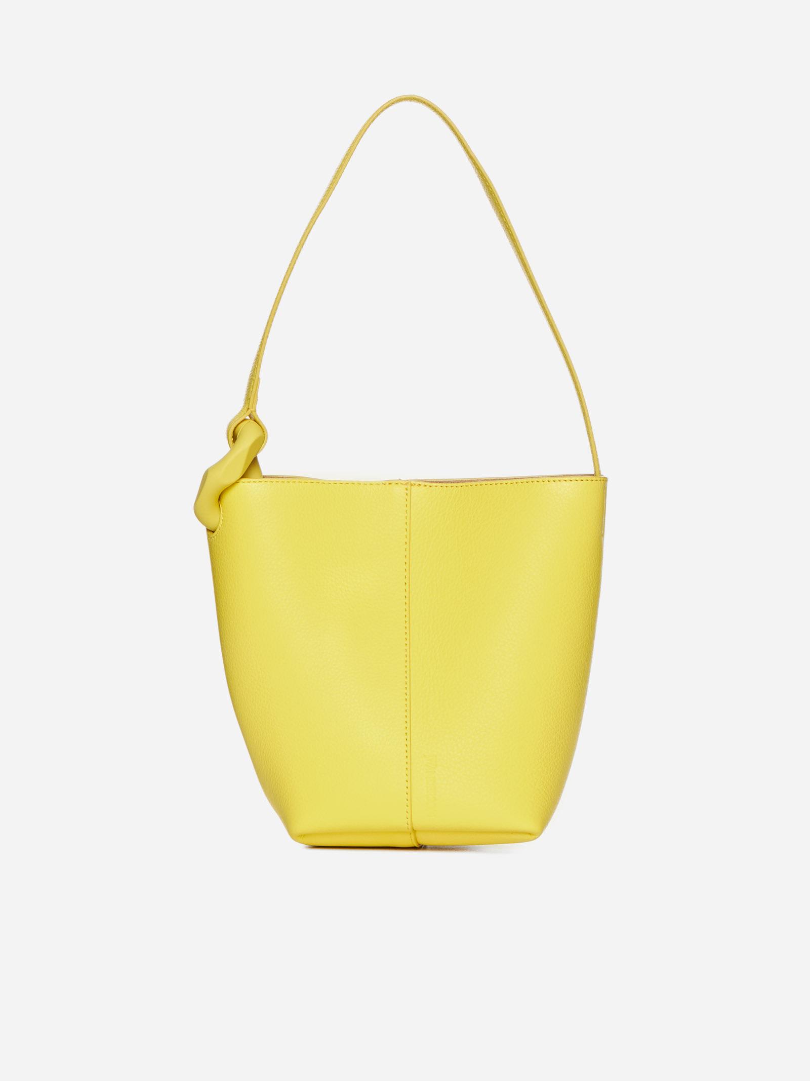Shop Jw Anderson Corner Leather Small Bucket Bag In Yellow