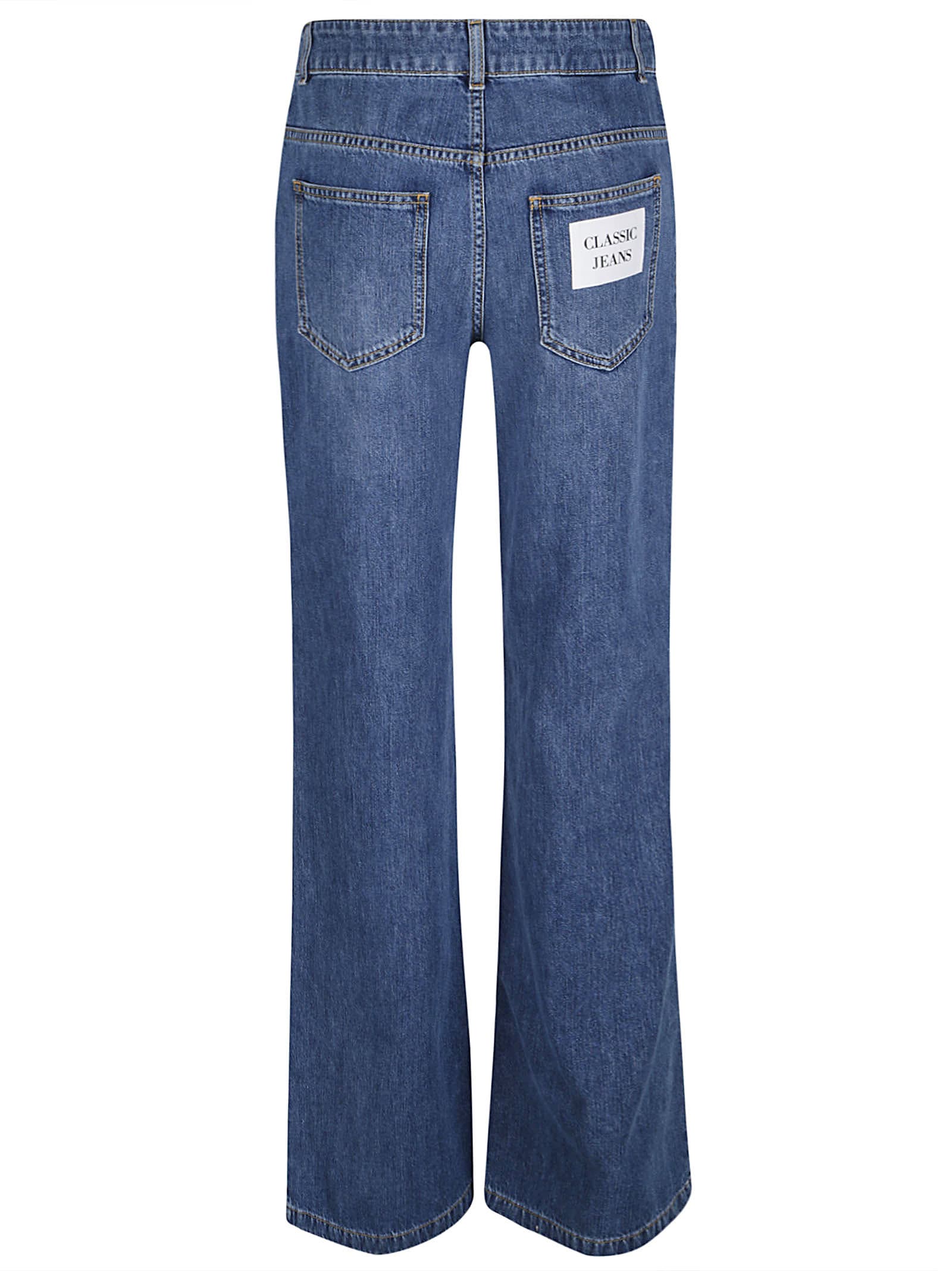 Shop Moschino Flared Leg Jeans In Denim Blue
