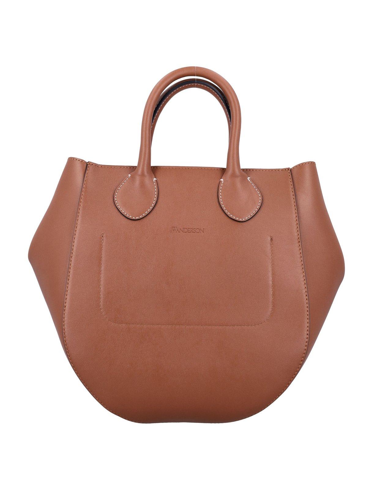 Shop Jw Anderson Small Punch Top Handle Bag In Brown