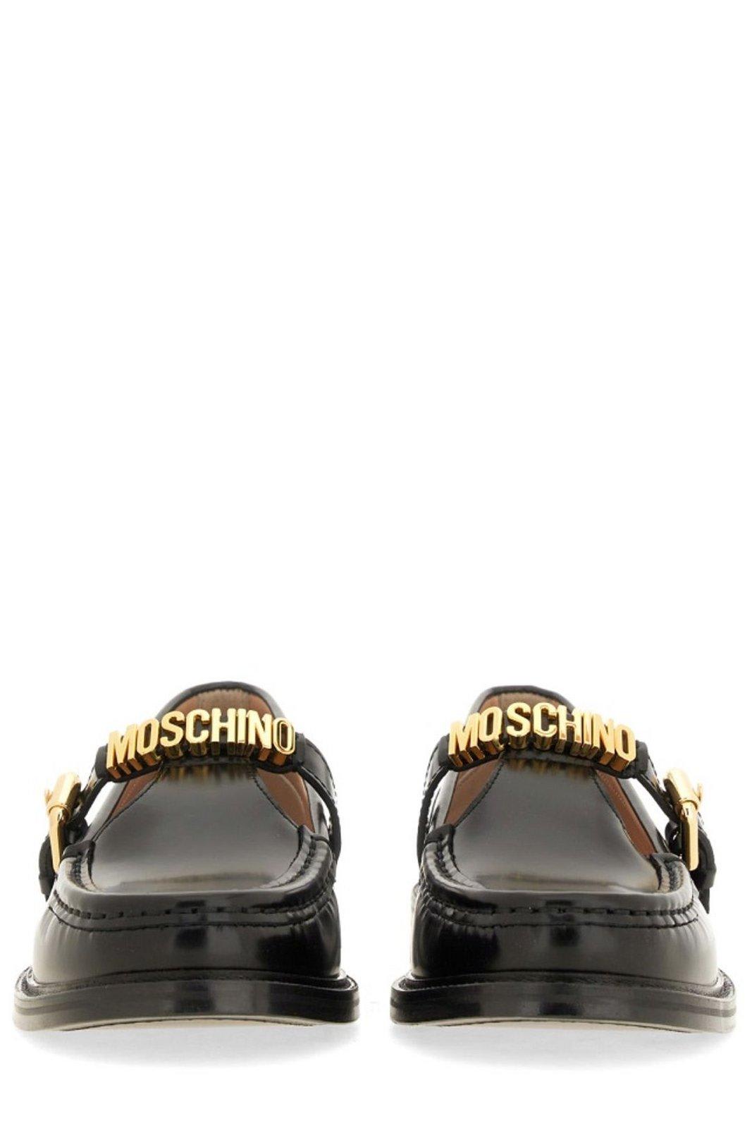 Shop Moschino Logo Lettering Slip-on Loafers In Black