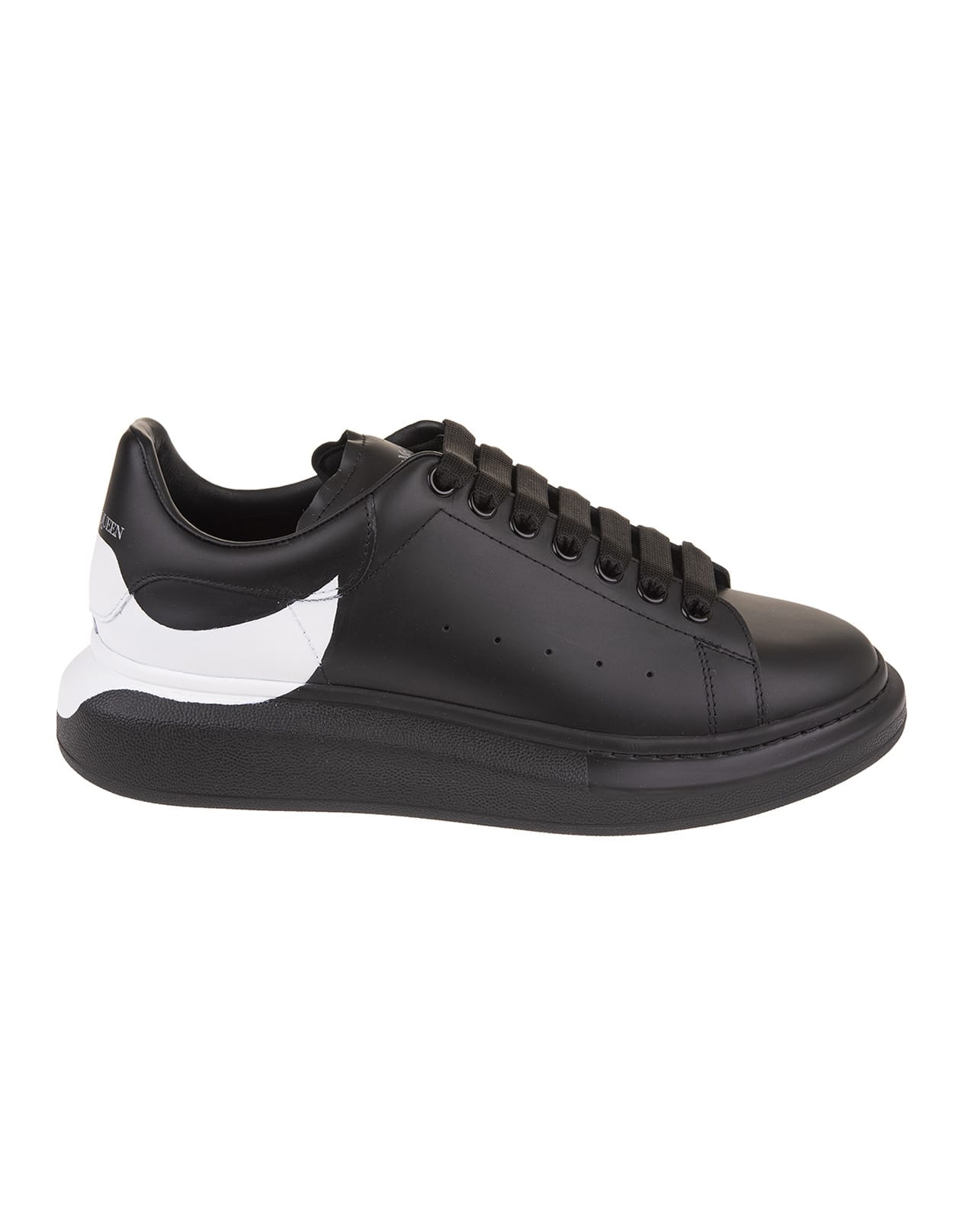 Alexander Mcqueen Man Black Oversize Sneakers With White Print On The Heel In Black/black/white
