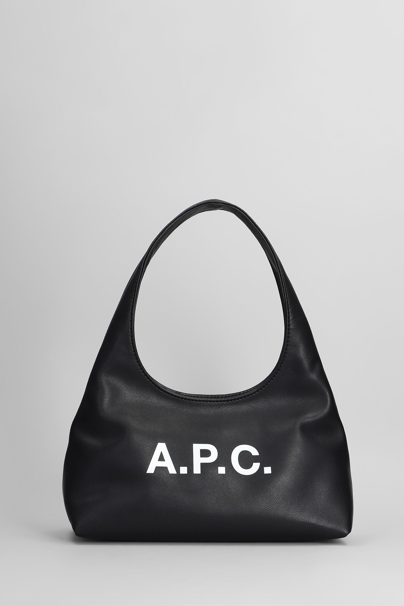 Apc Rounded Silhouette Shoulder Bag With Bold Logo In Black