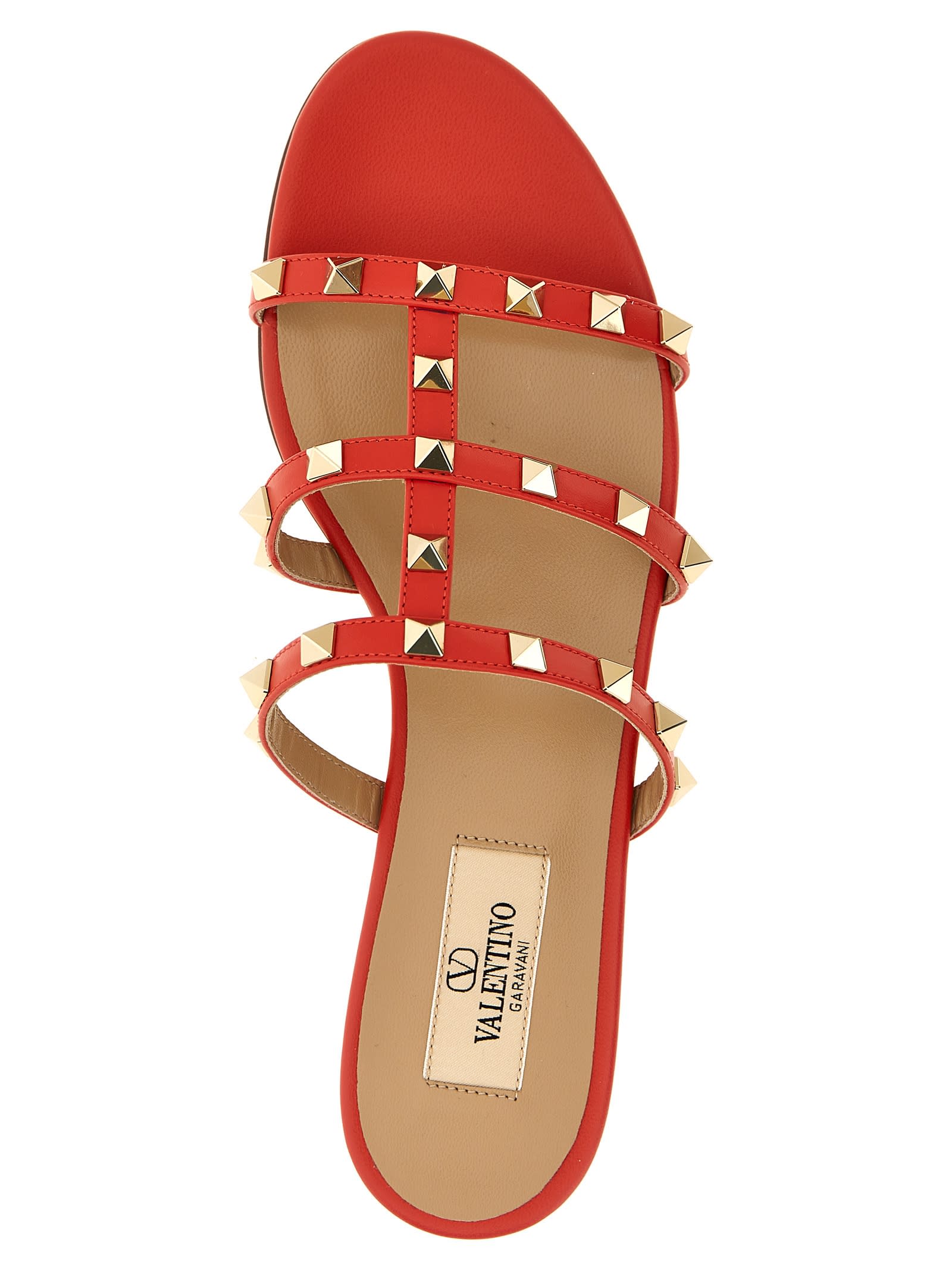 Valentino Rockstud Flat Sole Open Toe Sandals In Red