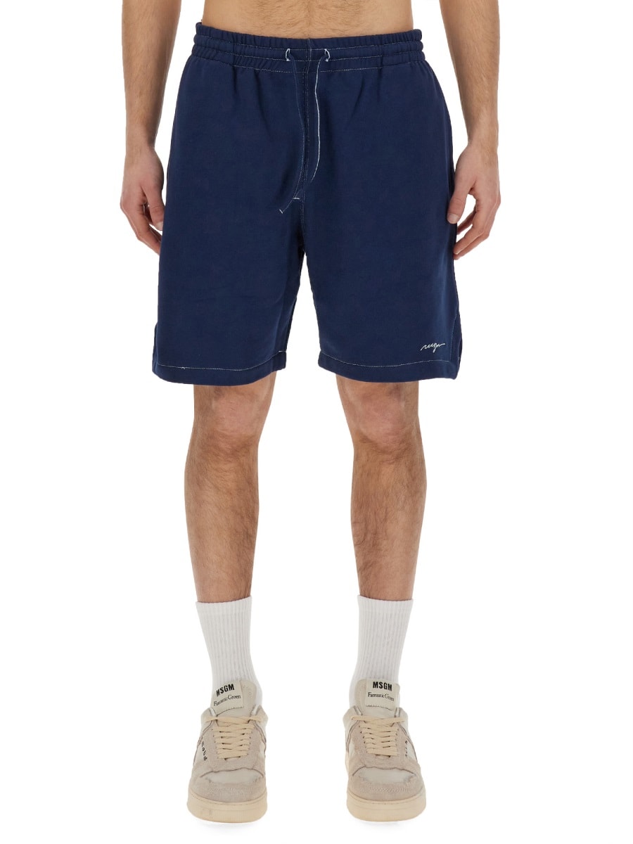 Shop Msgm Bermuda Shorts With Embroidered Logo In Blue