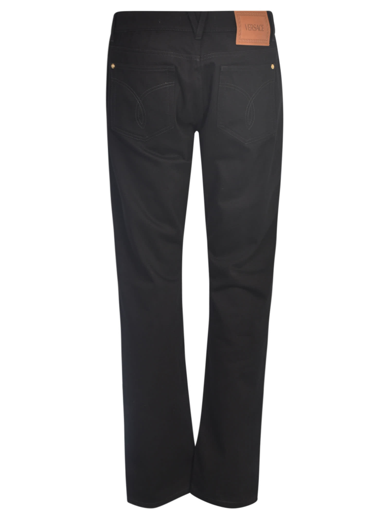 Shop Versace Straight Buttoned Jeans In Black