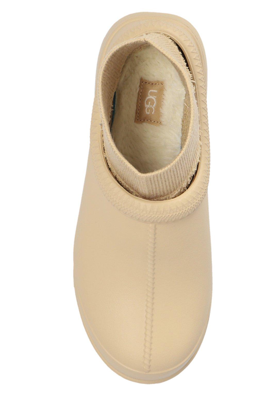 Shop Ugg Tasman Round Toe Ankle Boots In Beige