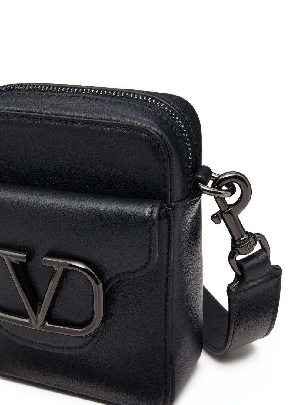 Shop Valentino Garavani Loc Go Plaque Mini Crossbody Bag In Black