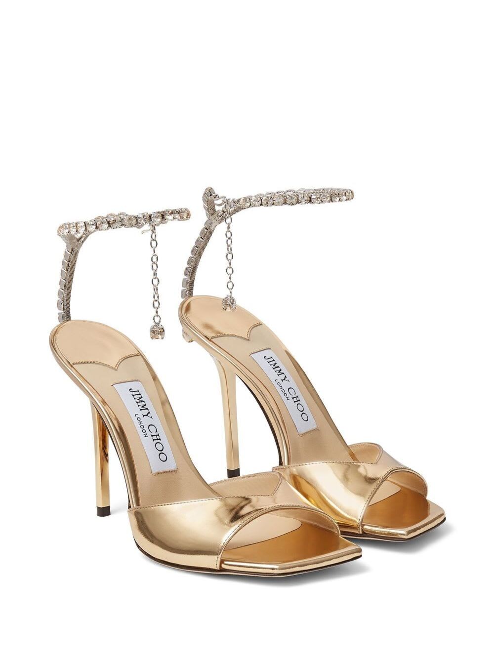 Shop Jimmy Choo Gold-tone Saeda Sandals With Crystal Embellishment In Calf Leather Woman In Metallic