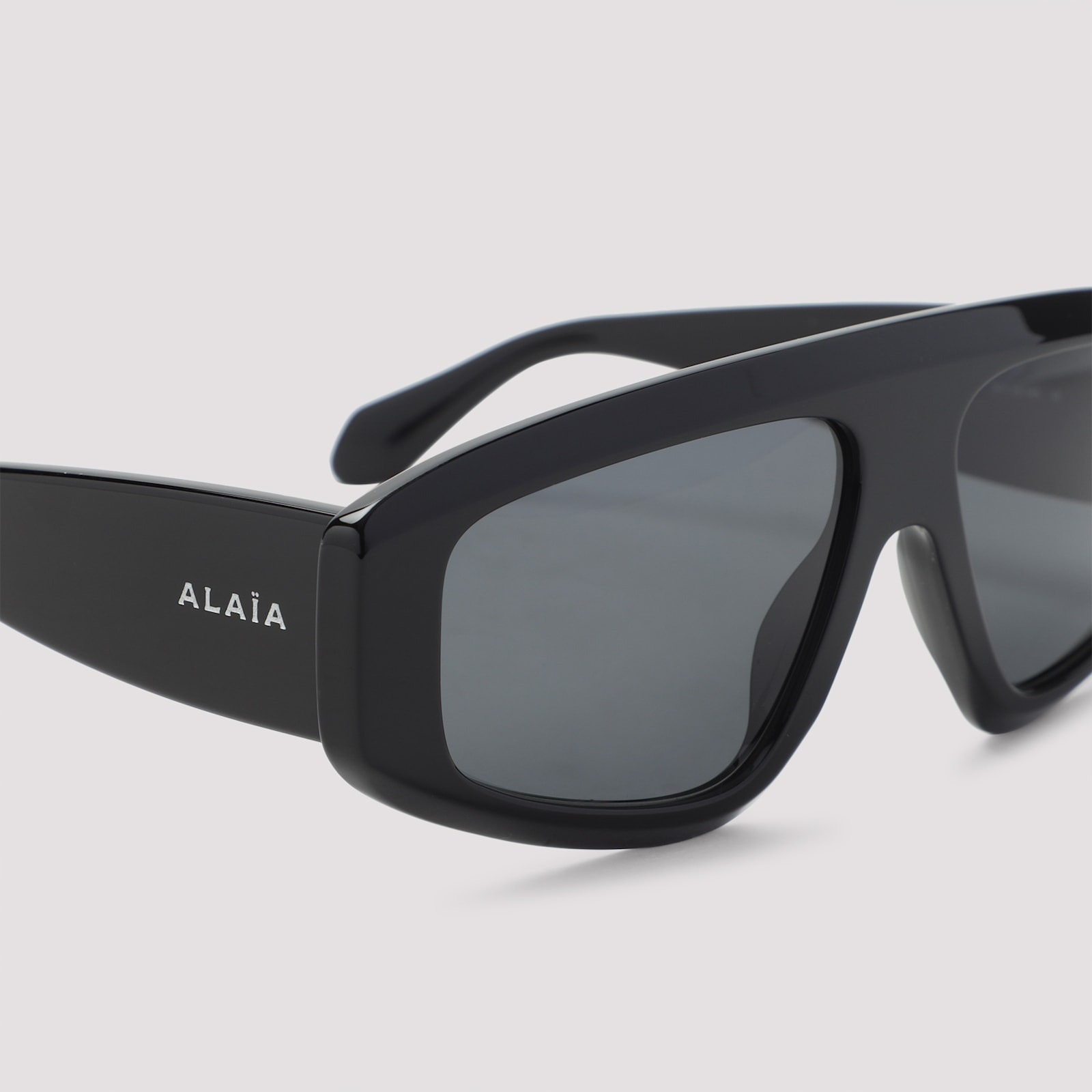 Alaïa Rectangular Frame Sunglasses Dark Lenses In Black