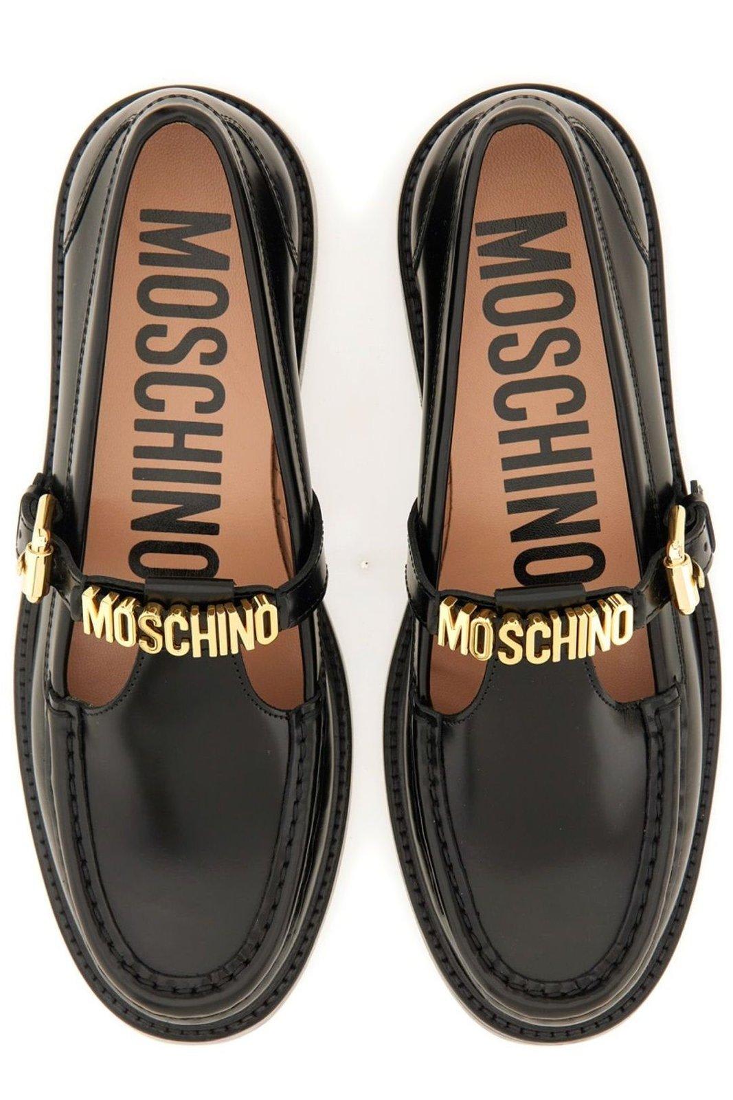 Shop Moschino Logo Lettering Slip-on Loafers In Black