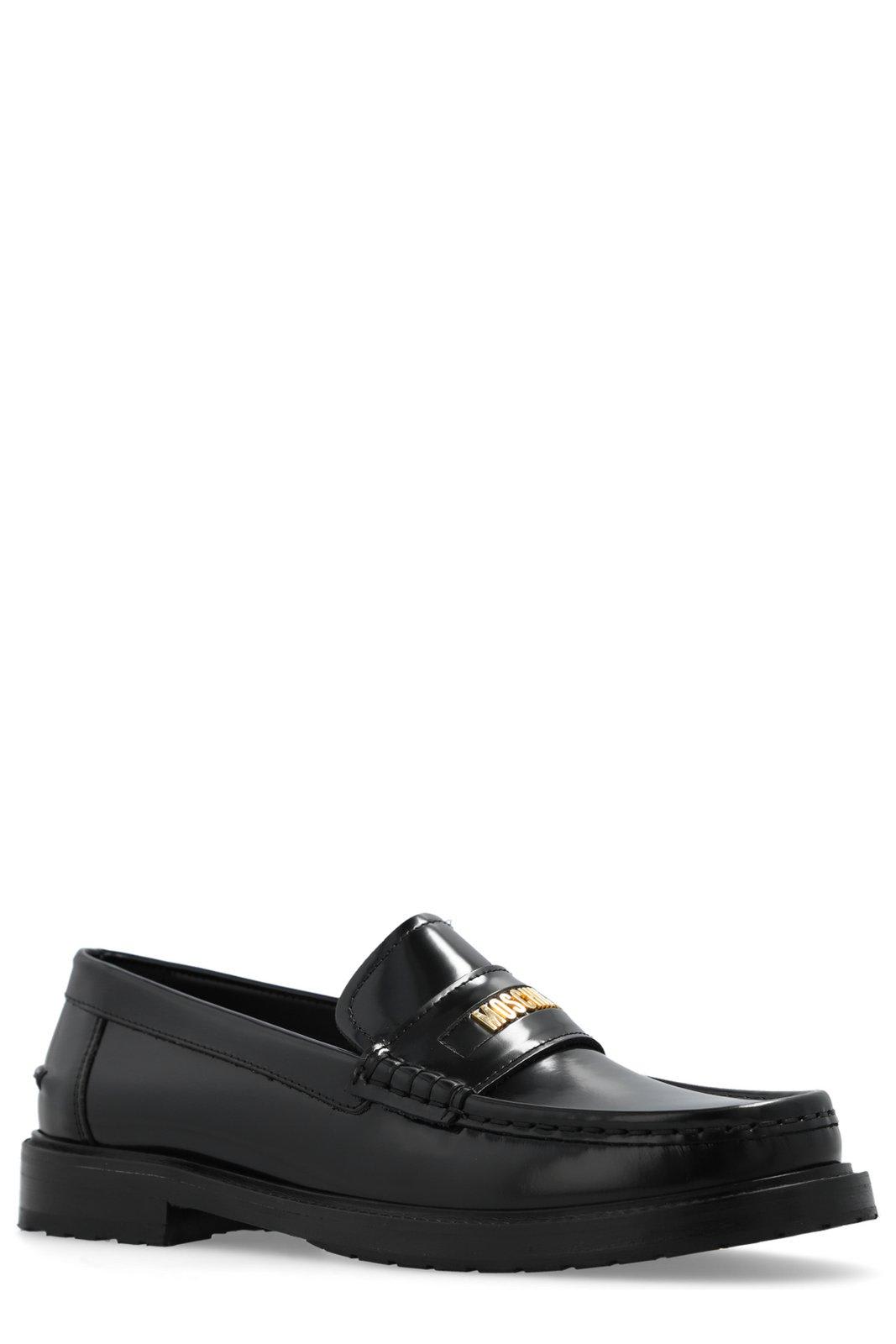 Shop Moschino Logo Plaque Slip-on Loafers In Black