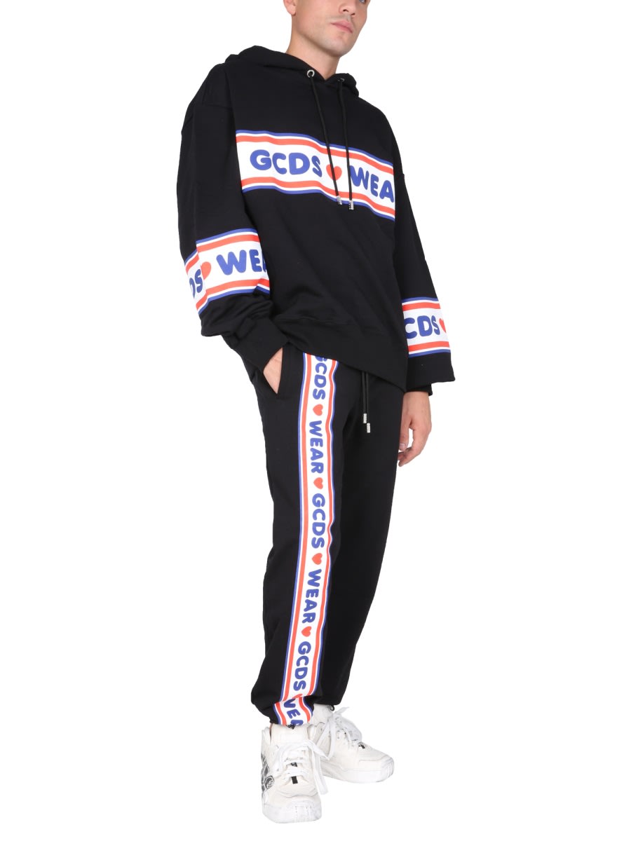 Shop Gcds Jogging Pants With Cute Tape Logo Band In Black