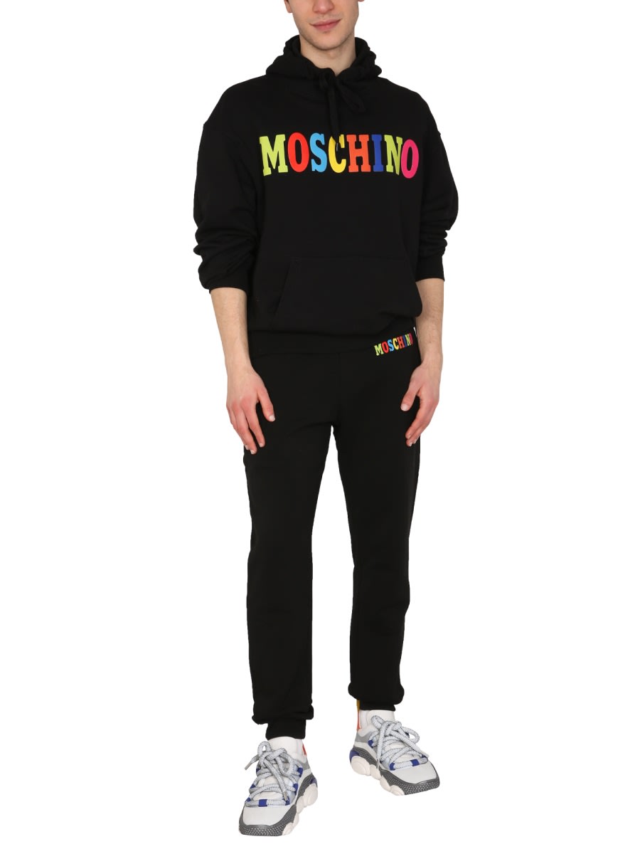 Shop Moschino Multicolor Logo Jogging Pants In Black