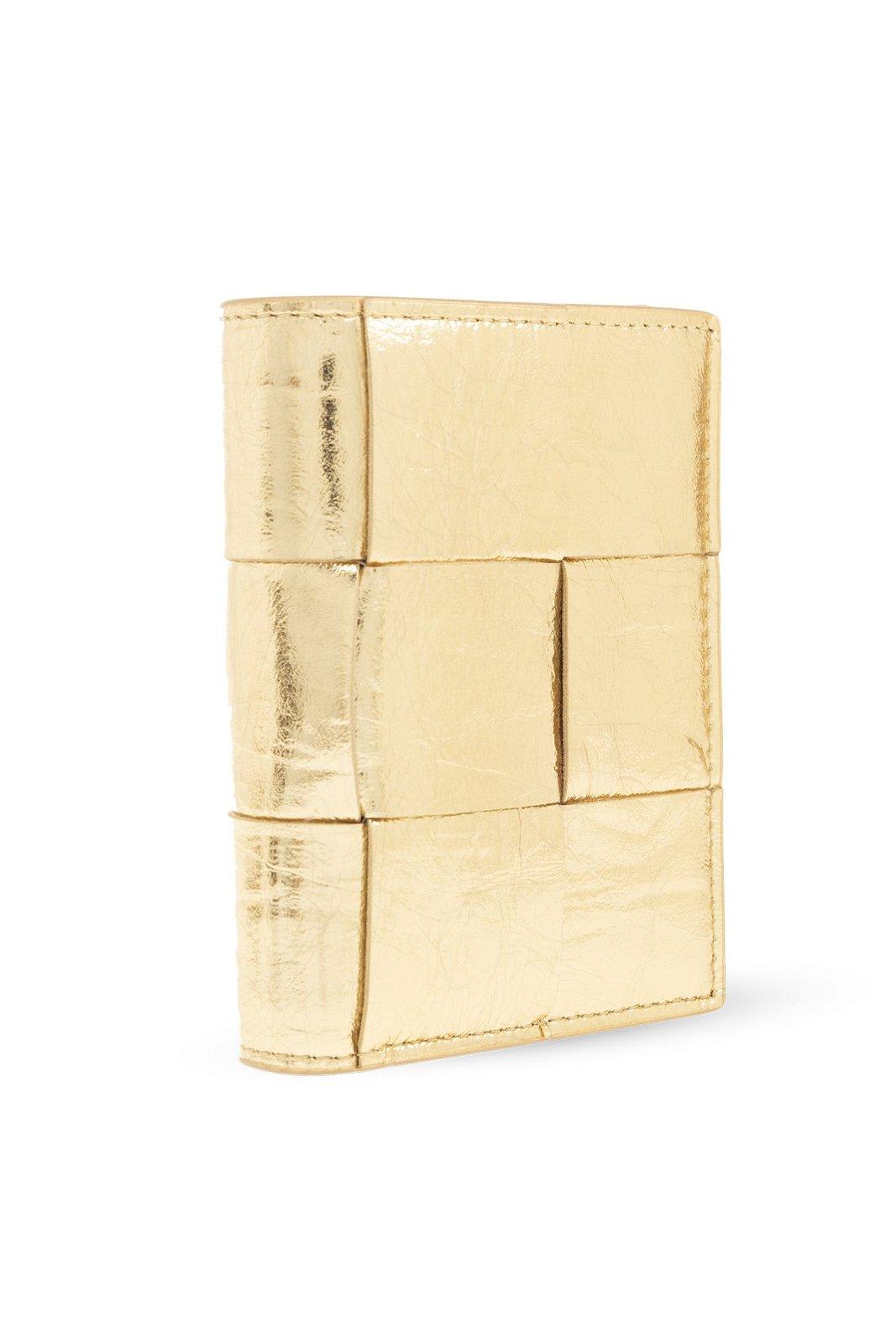 Shop Bottega Veneta Cassette Small Bi-fold Zip Wallet In Gold-gold