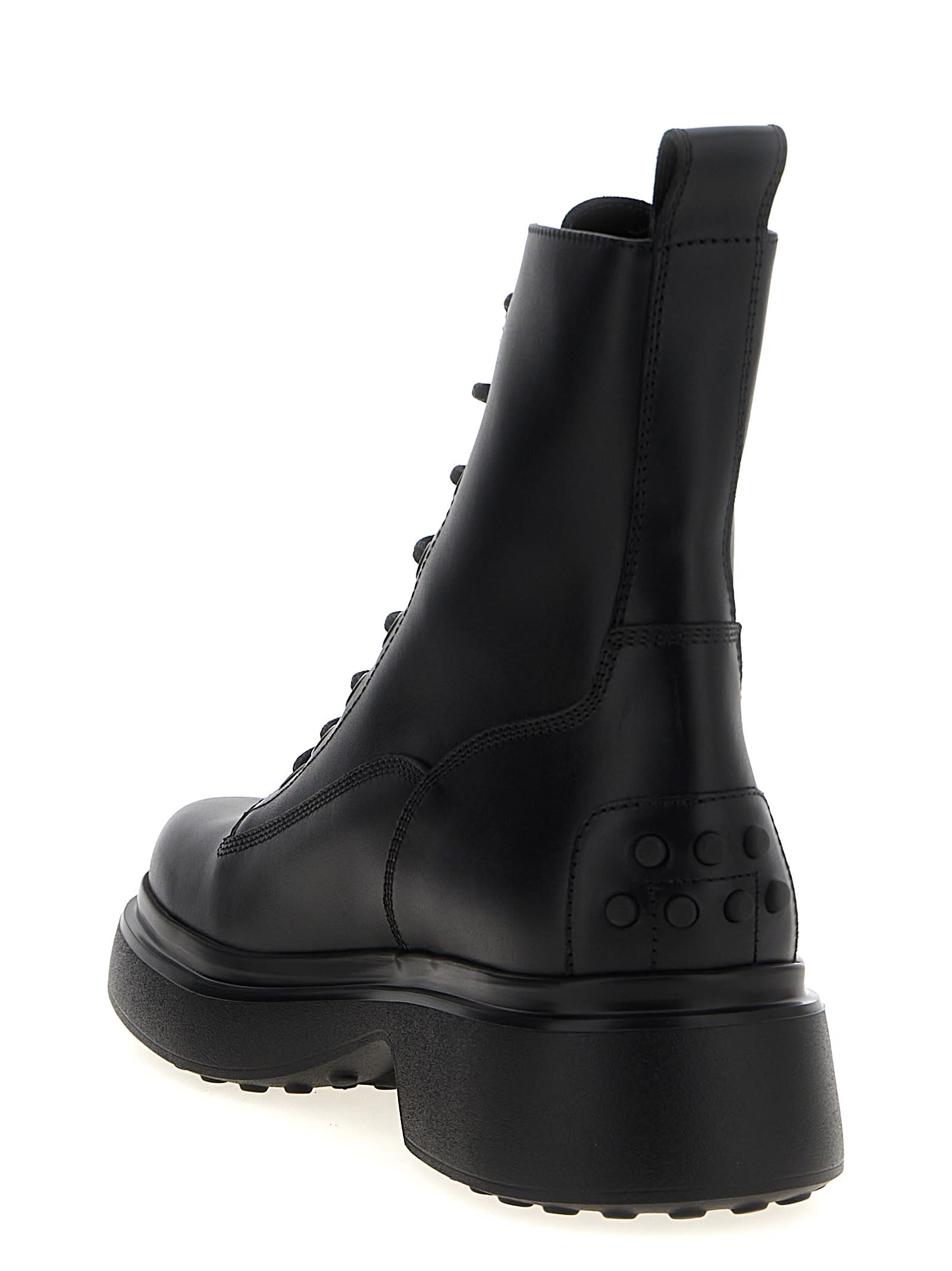 Tod's Chunky Sole Round Toe Ankle Boots With Pull Tab In Black