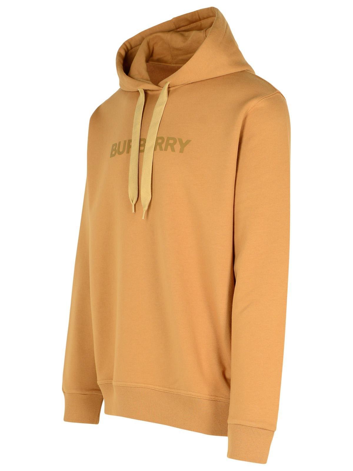 Shop Burberry Logo Printed Drawstring Hoodie In Beige