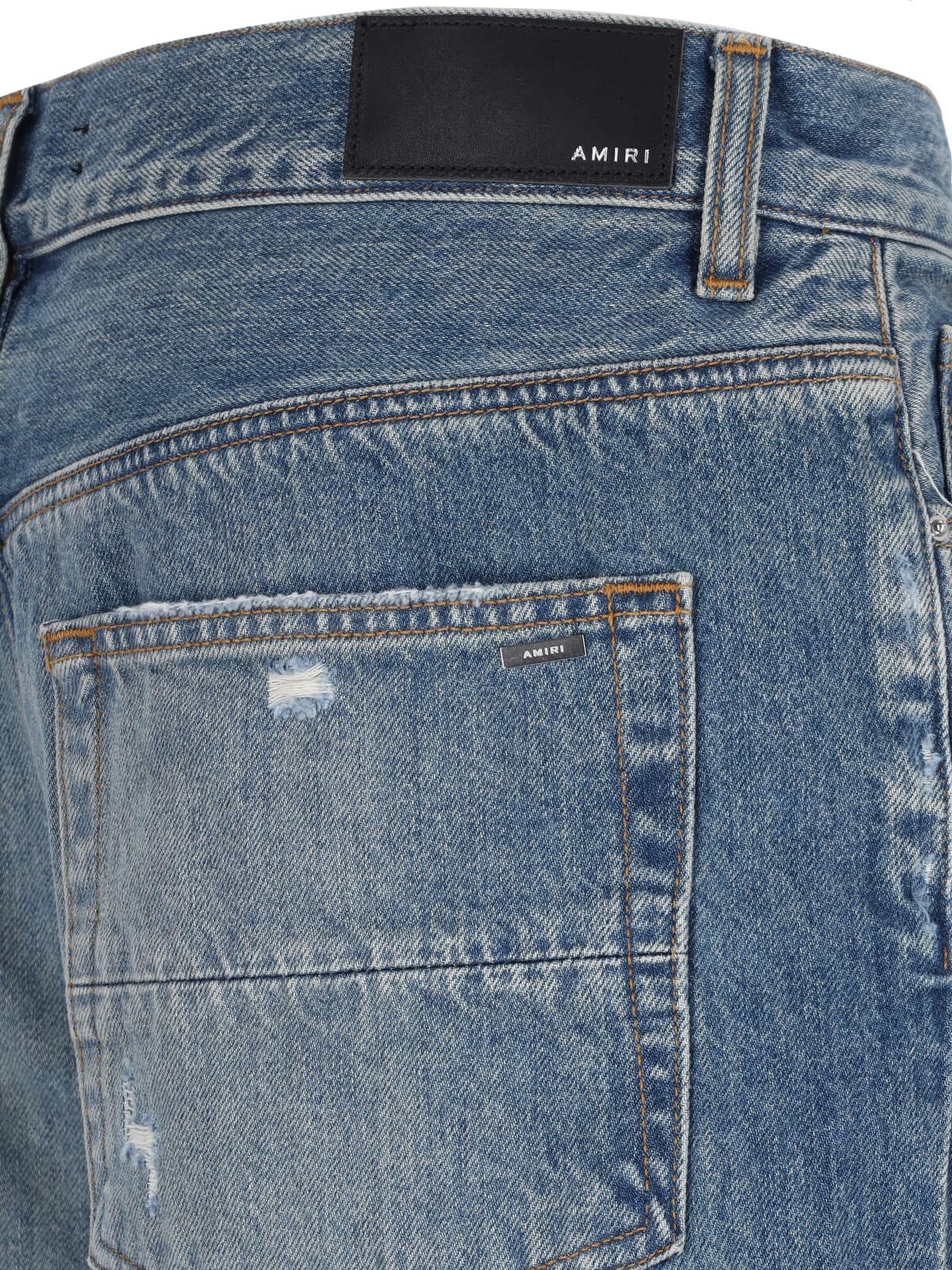 Shop Amiri Destroyed Detail Jeans In Blue