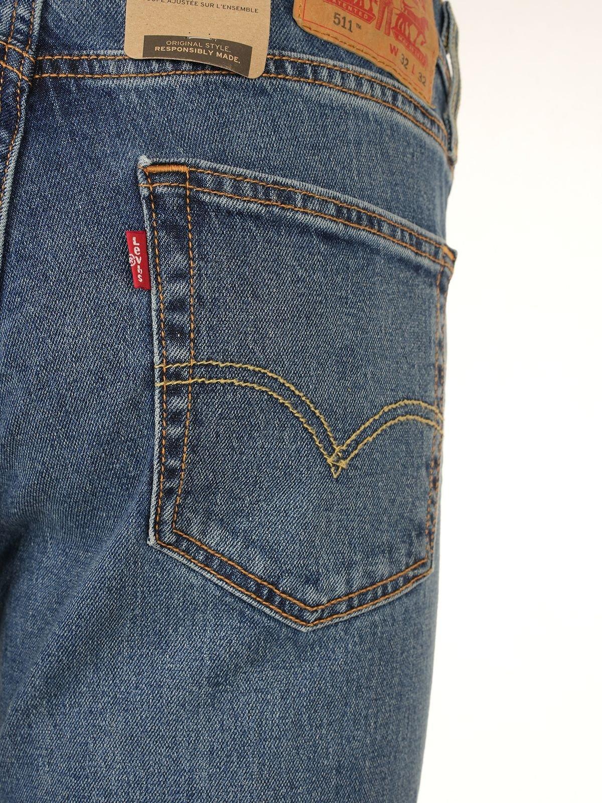 Shop Levi's Mid Rise Straight Leg Jeans In Blue