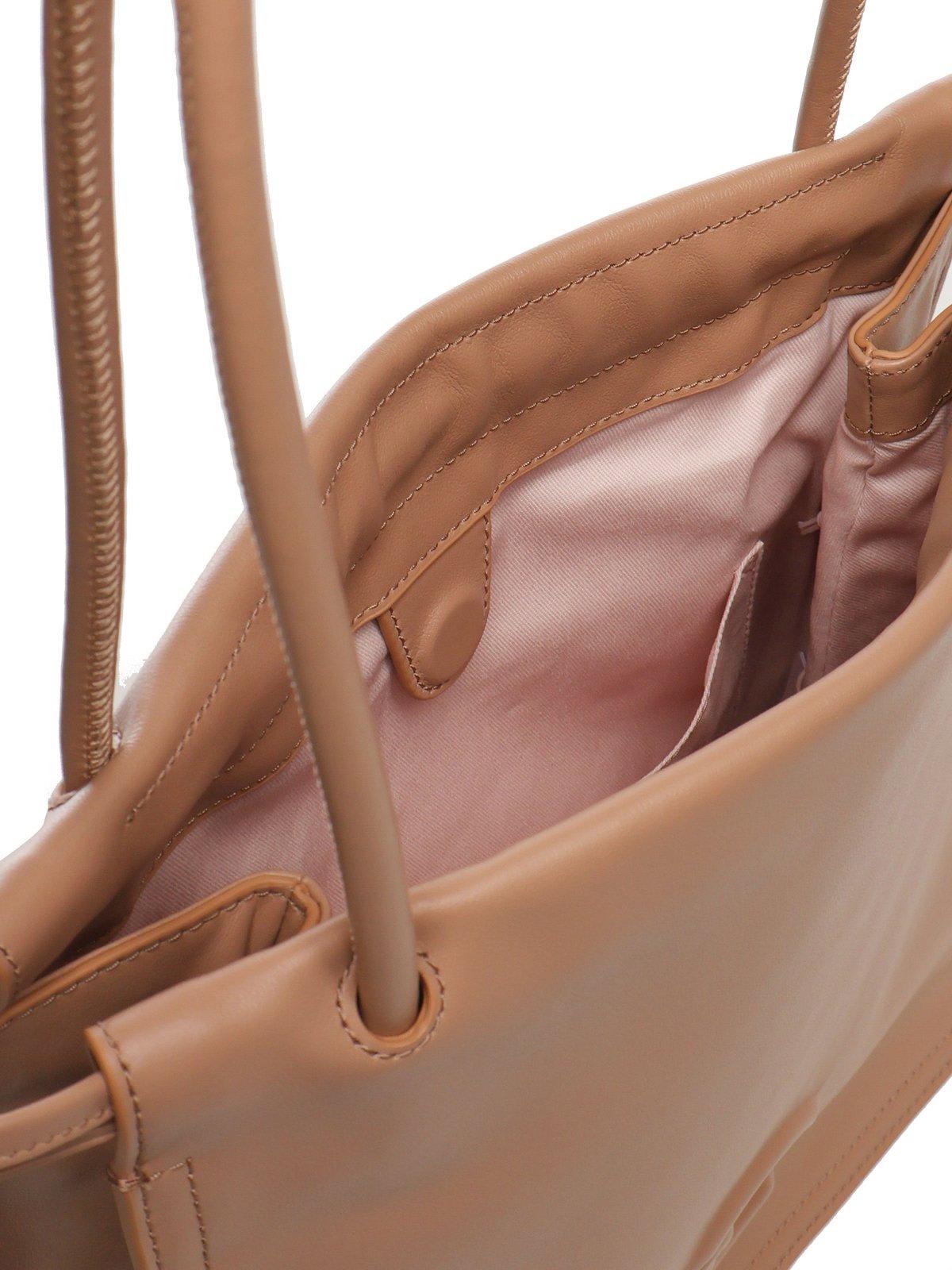 COCCINELLE LOGO EMBOSSED DRAWSTRING TOTE BAG
