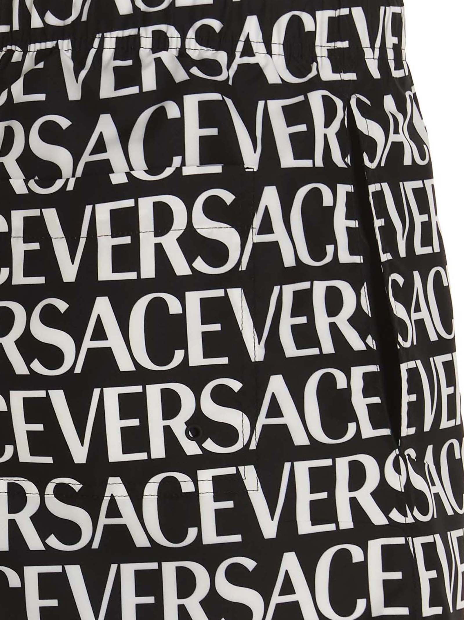Shop Versace Logomania Swimming Trunks In White/black
