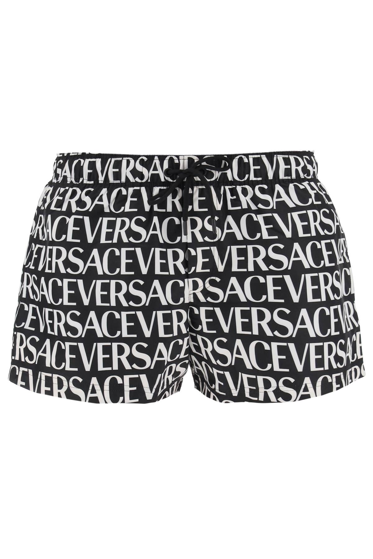 Shop Versace Allover Swim Trunks In Black White (white)