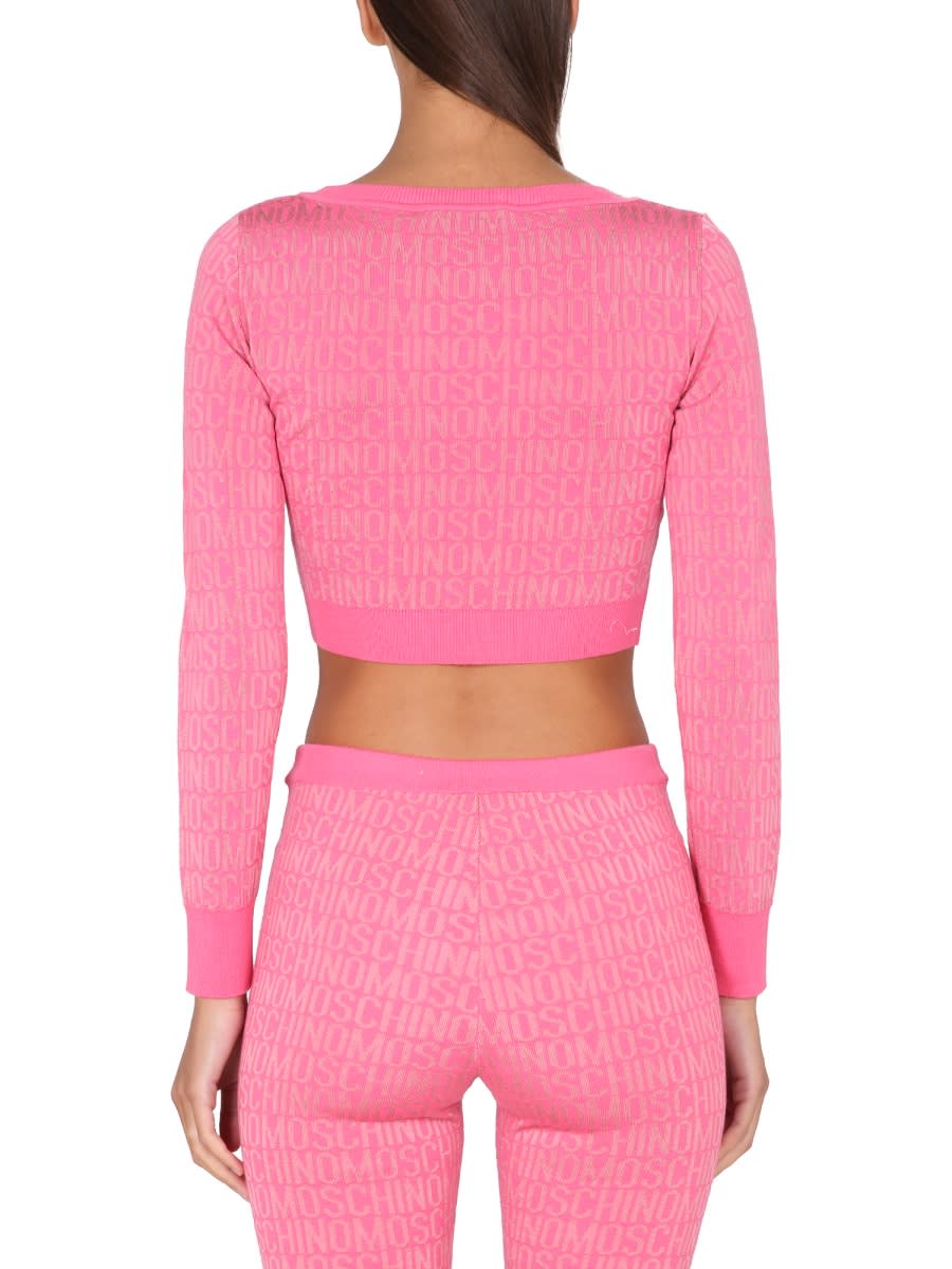 Moschino Cropped Pullover With Allover Logo Pattern In Pink