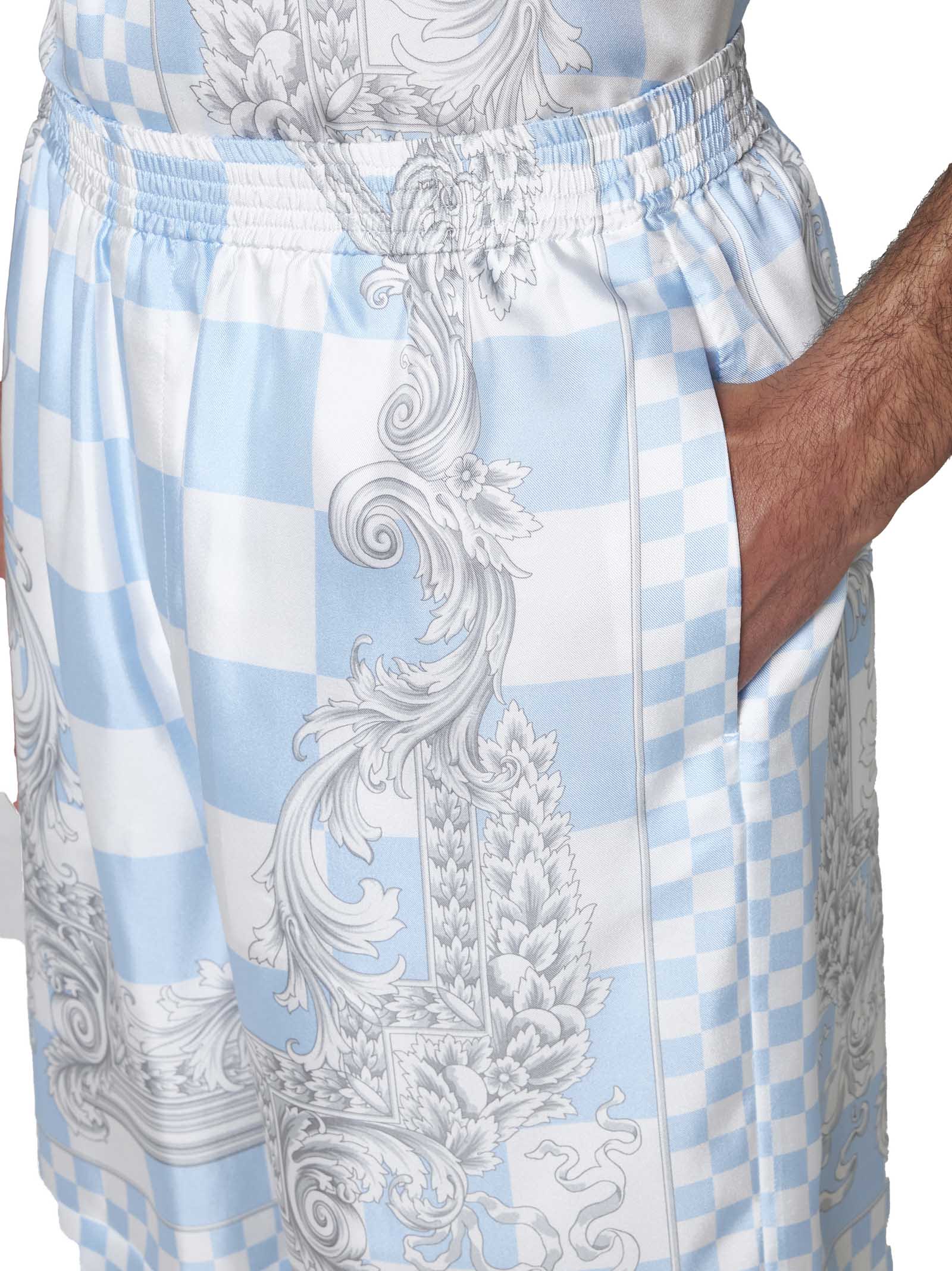 Shop Versace Shorts In Pastel Blue+white+silver