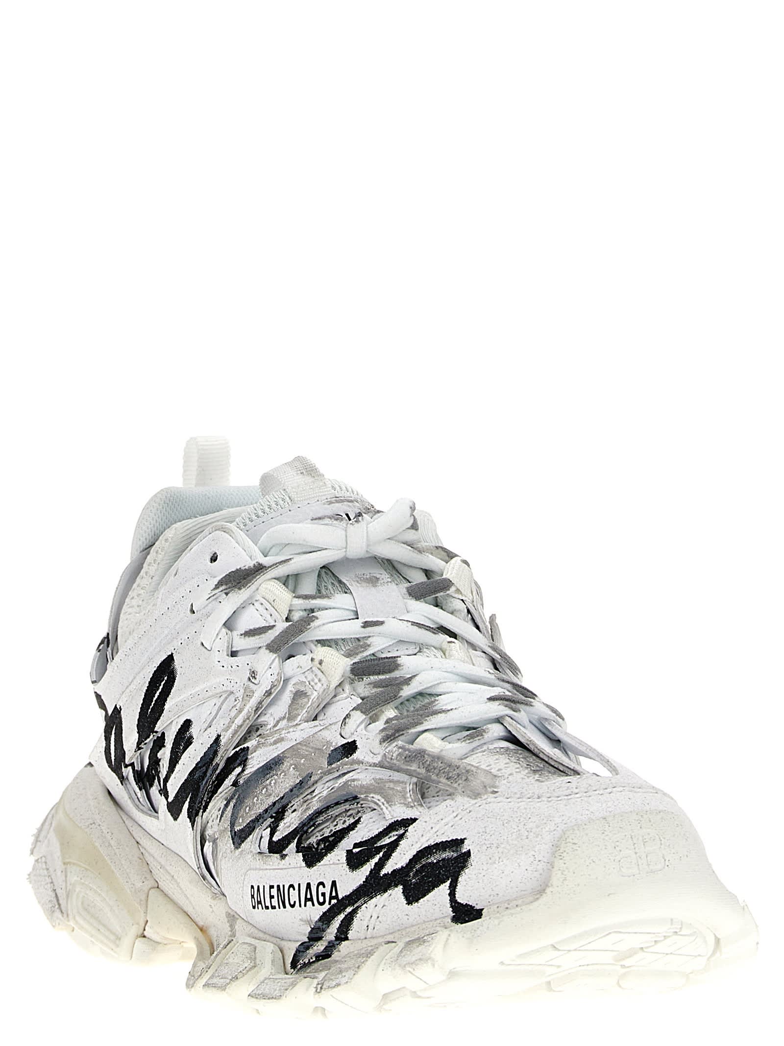 Shop Balenciaga Track Sneakers In White/black