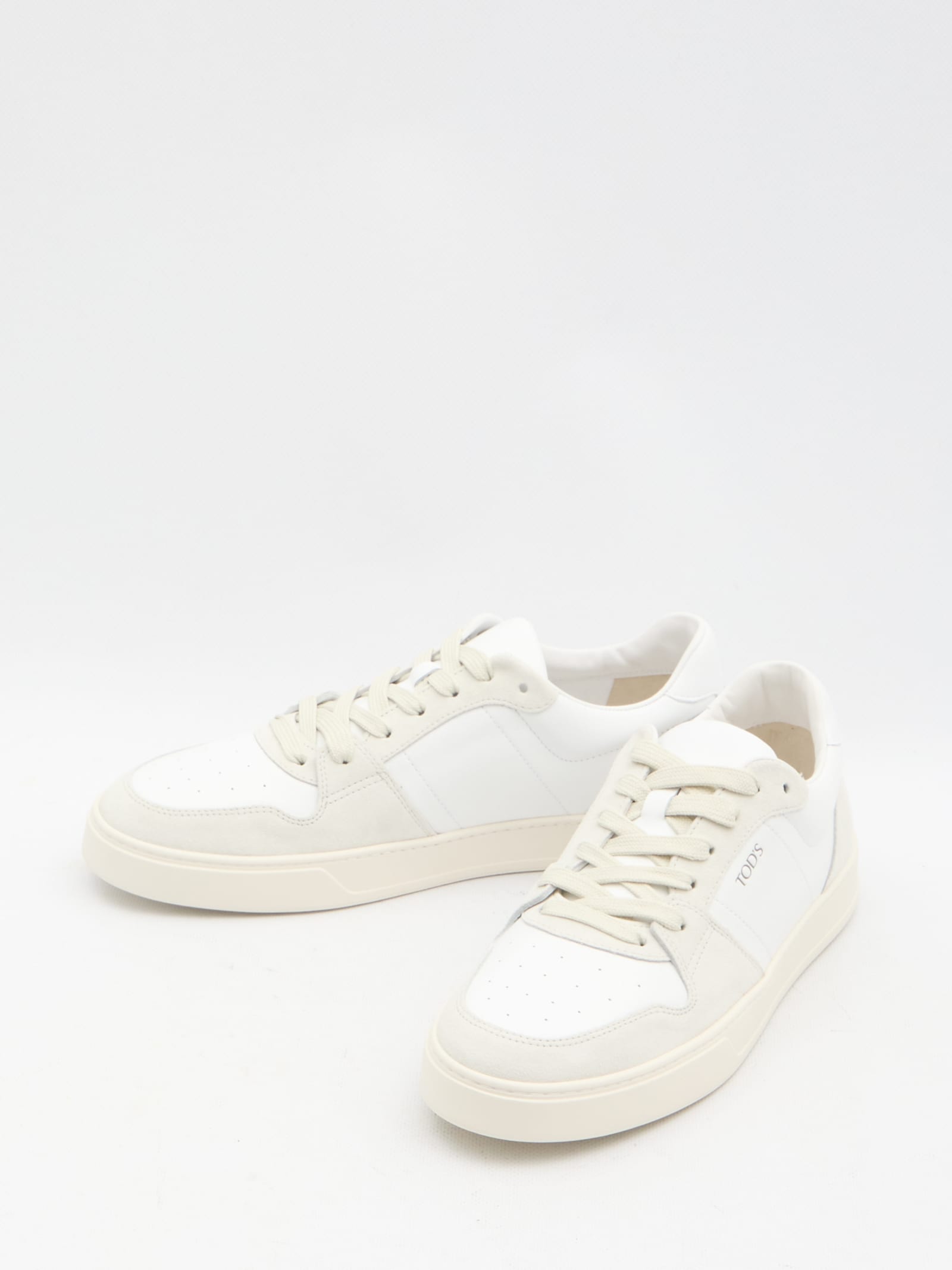 Shop Tod's Leather Sneakers In White