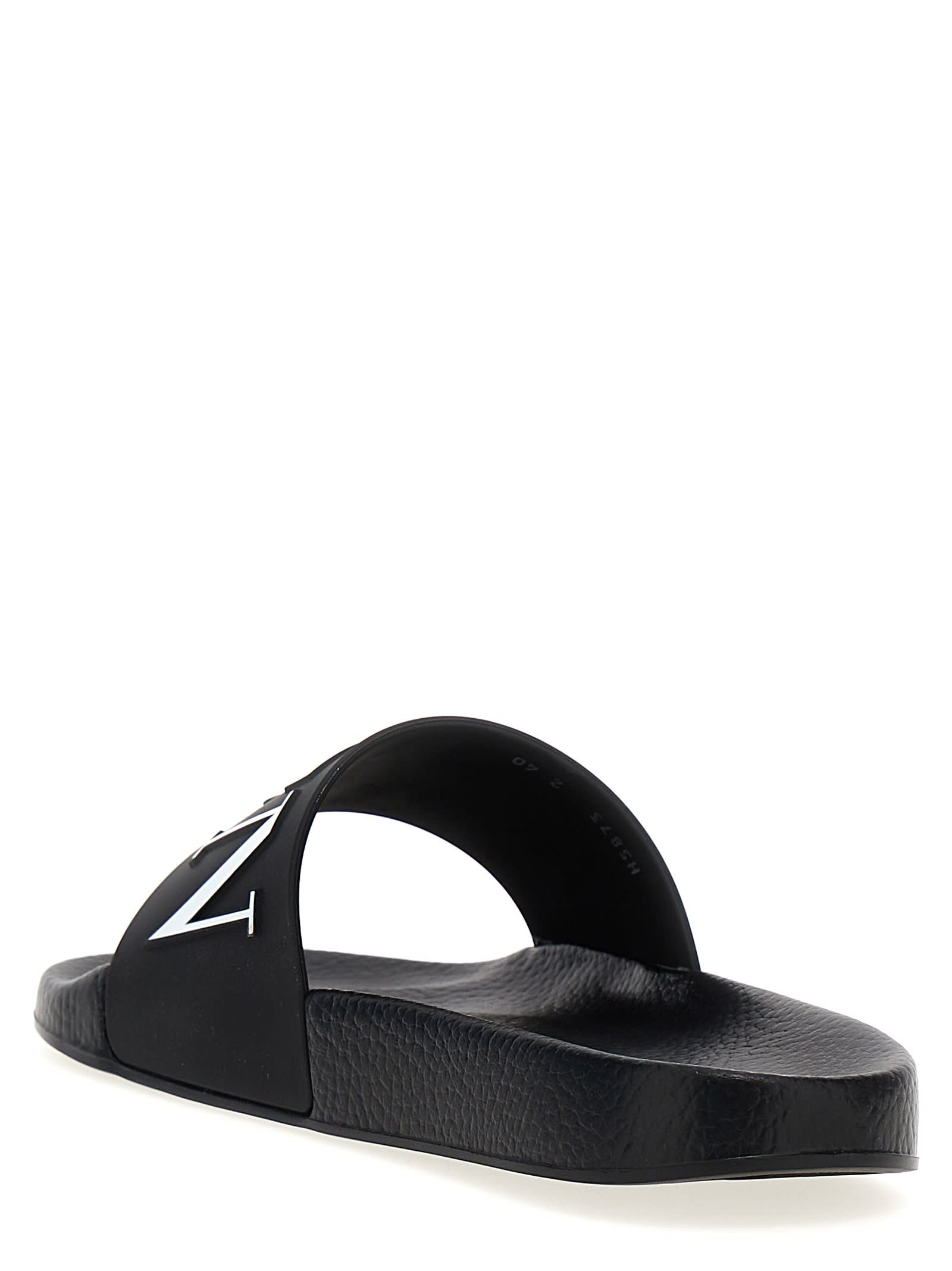 Shop Valentino Garavani Vltn Slides In White/black