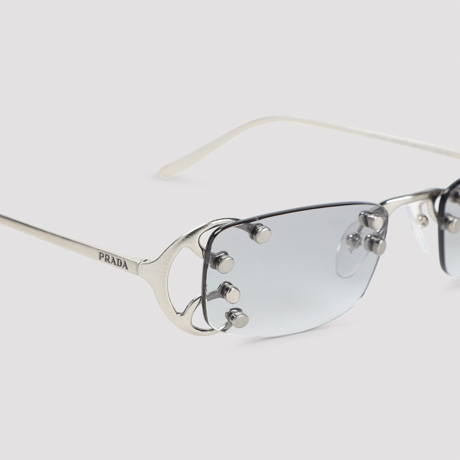 Prada Rimless Rectangular Sunglasses With Polished Metal Frames In Silver