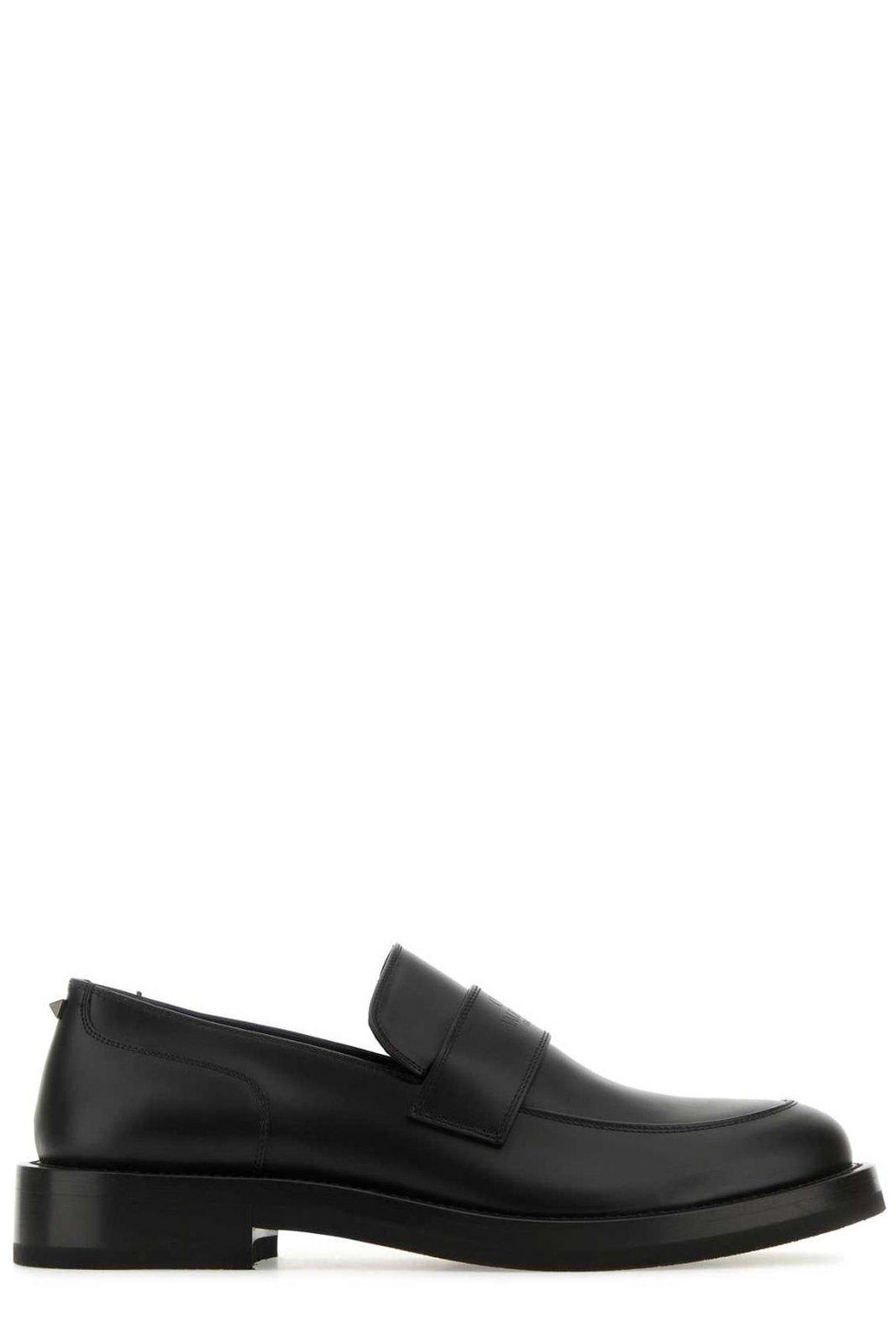 Shop Valentino Round Toe Slip-on Loafers In Black